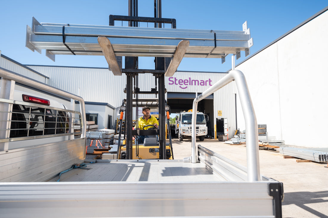 Forklifting loading steel at Coolum