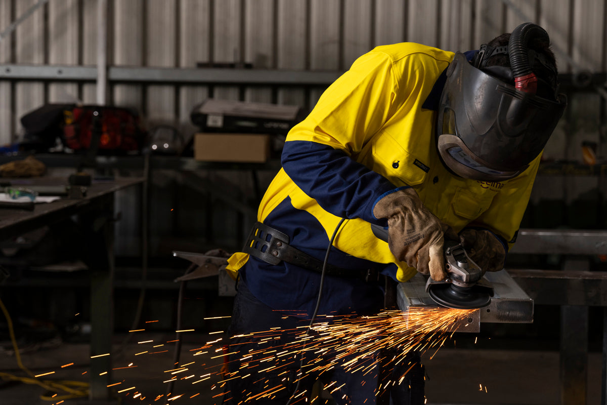 close-up-steel-fabrication-grinding-with-sparks